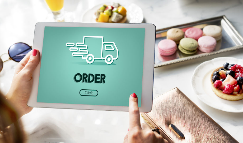 woman placing a delivery order on her ipad