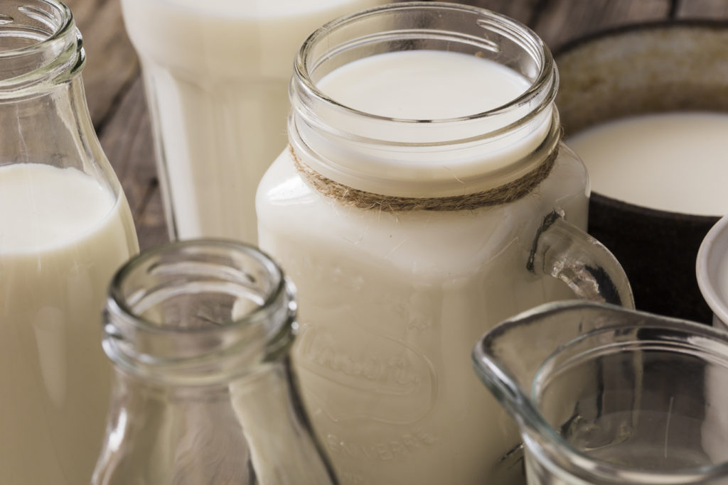 close up photo of glass jars filled with milk