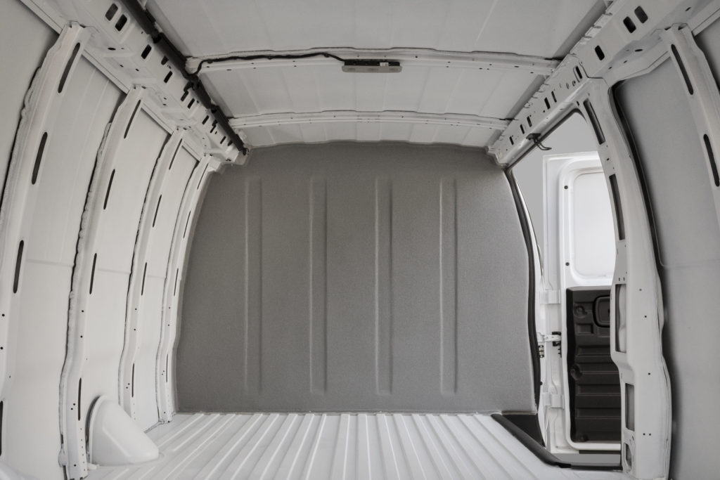 photo of a cargo van interior with sealed bulkhead for hazardous chemical transport