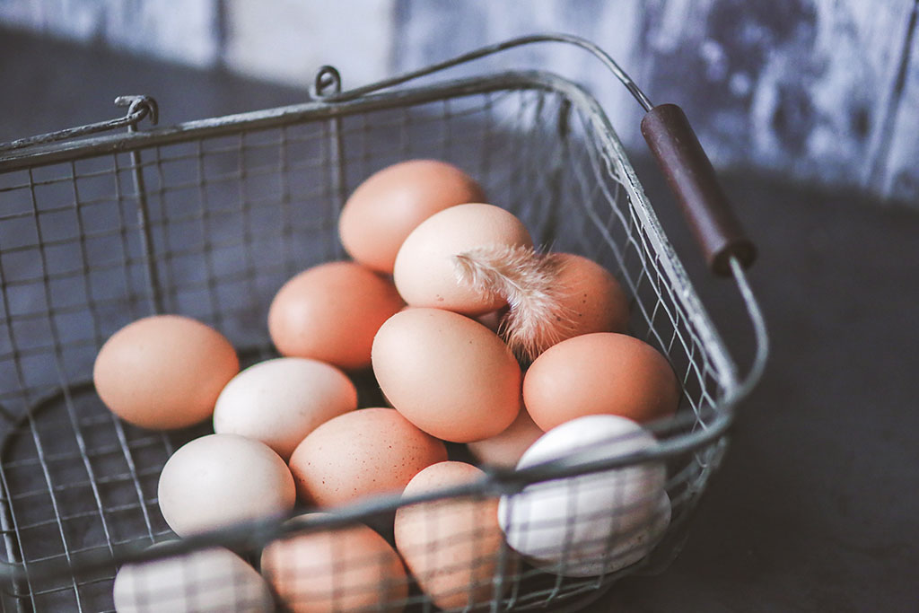 photo of farm fresh eggs in a wire basket